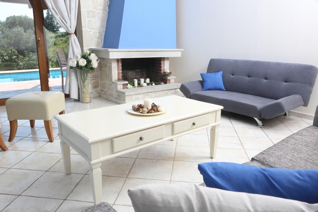 Alia Palace Hotel - Adults Only 16+ Chalkidiki Exterior photo A living room with a fireplace