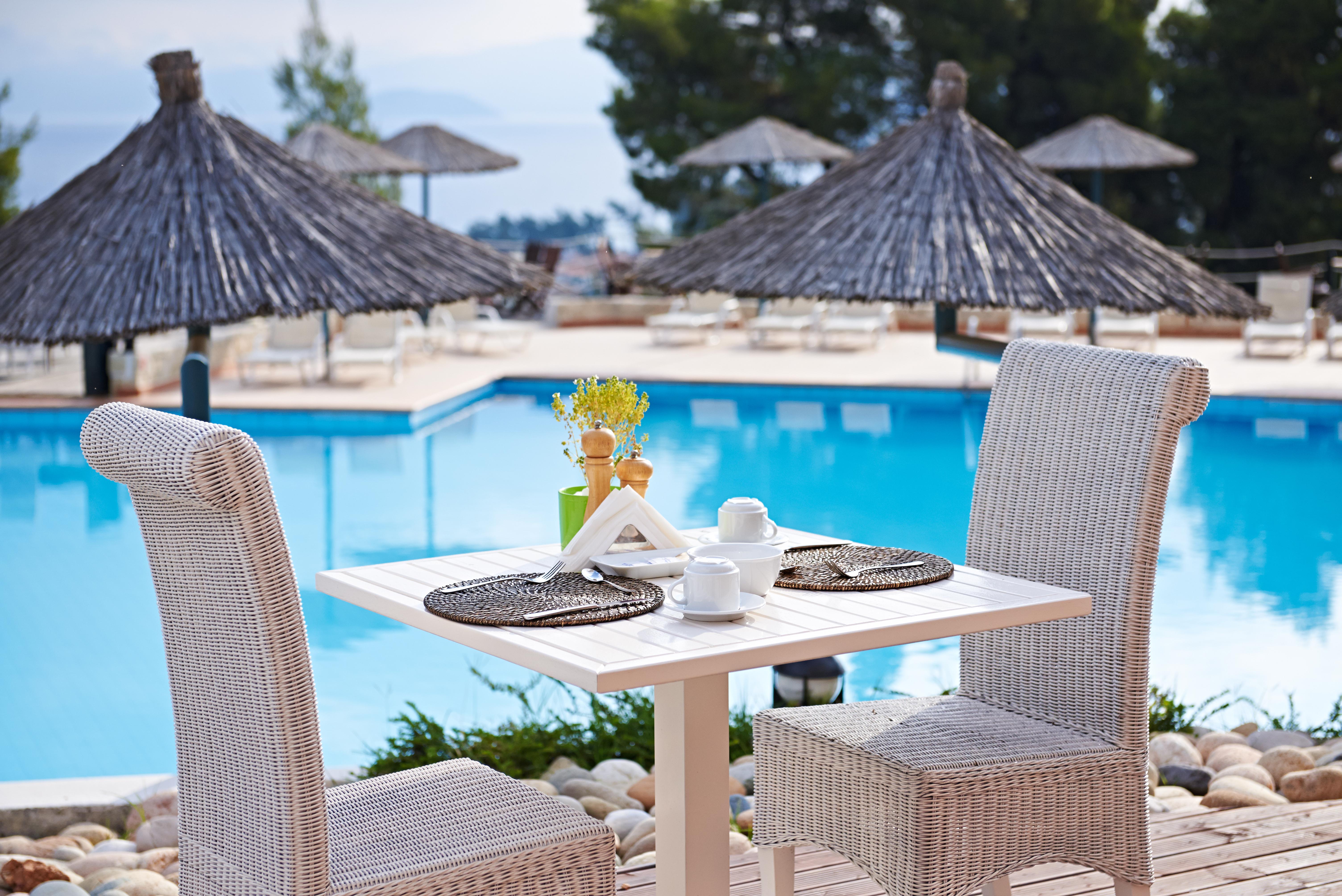 Alia Palace Hotel - Adults Only 16+ Chalkidiki Exterior photo A poolside table at a hotel