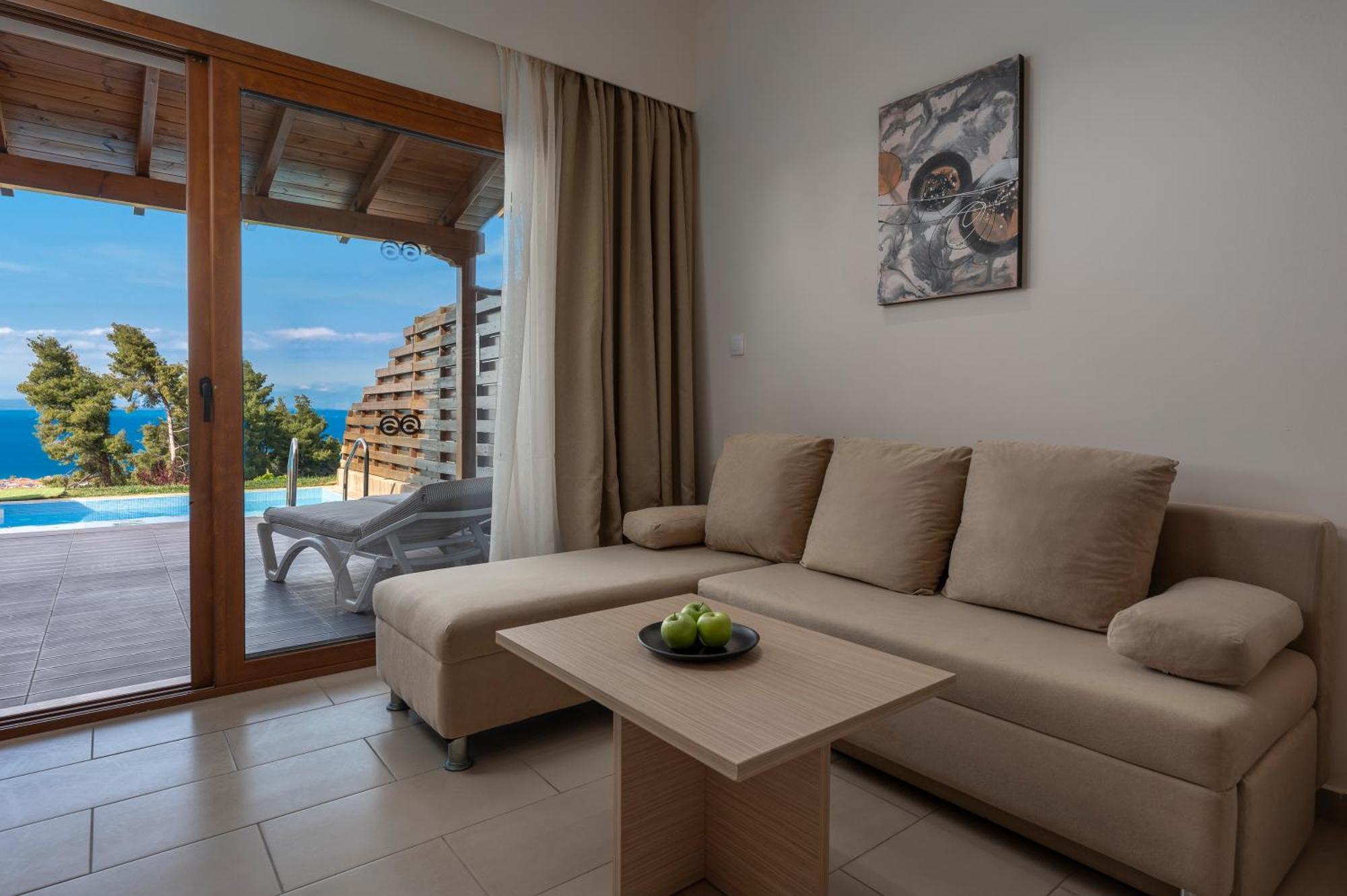 Alia Palace Hotel - Adults Only 16+ Chalkidiki Exterior photo A living room with a sofa