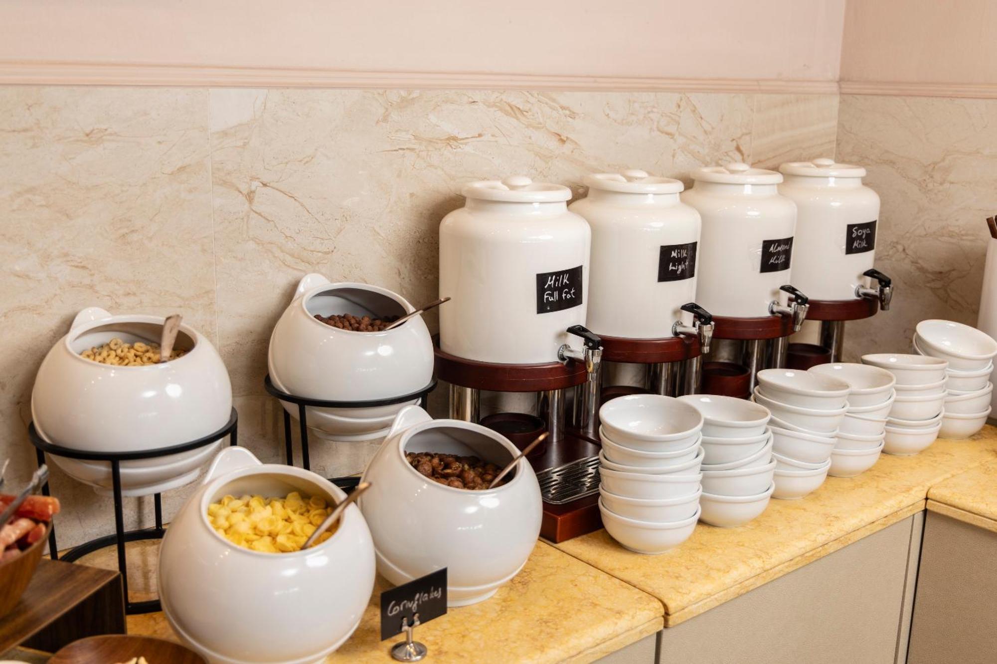 Alia Palace Hotel - Adults Only 16+ Chalkidiki Exterior photo A selection of teas at a buffet