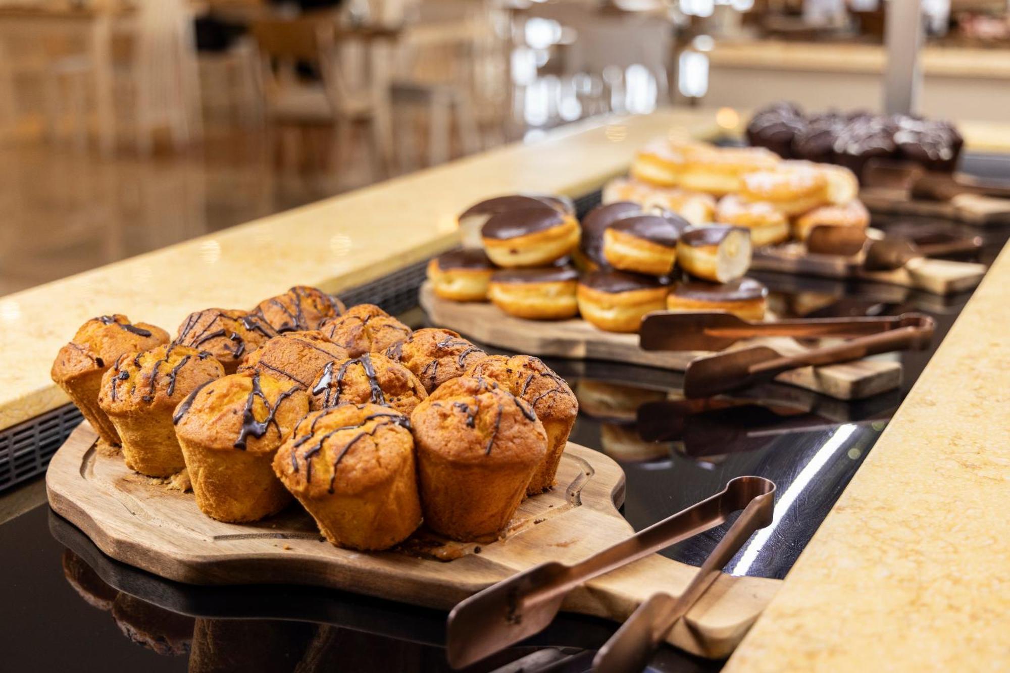 Alia Palace Hotel - Adults Only 16+ Chalkidiki Exterior photo A selection of pastries at a buffet